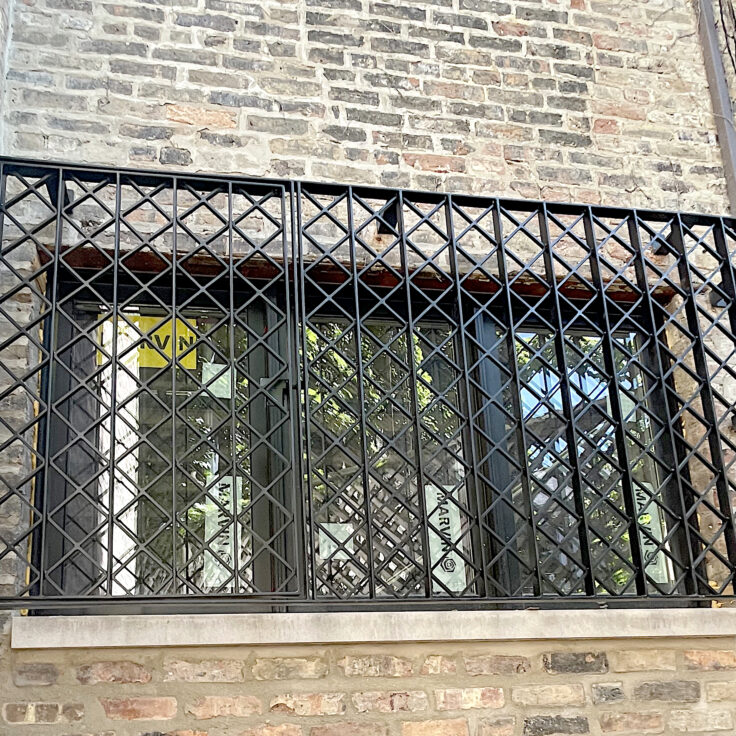 Traditional wrought iron window guards painted satin black in Greenbay