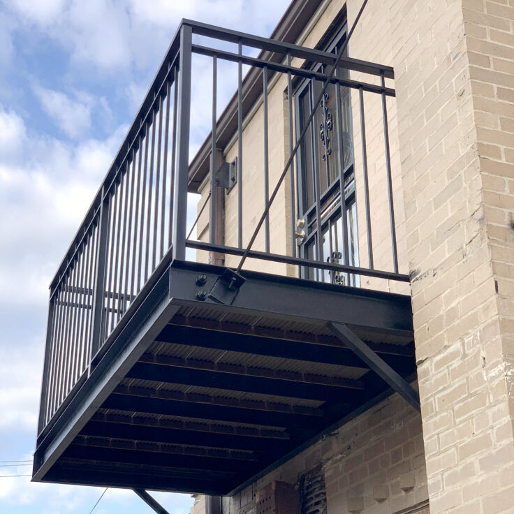 Traditional wrought iron & wood balconies painted satin black in Evanston bottom view