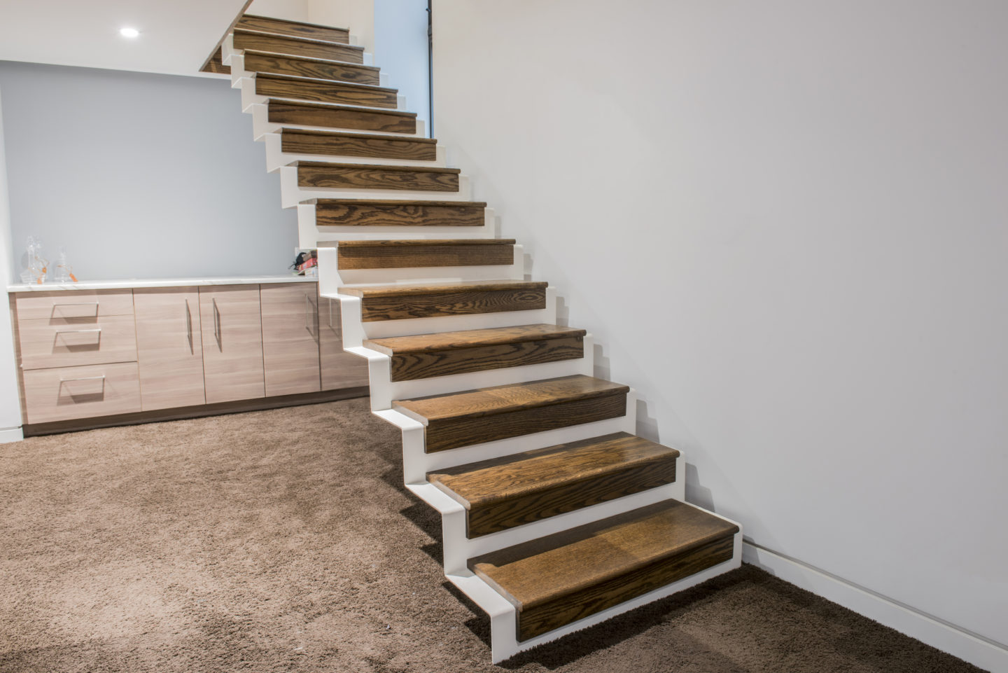 Custom contemporary wrought iron folded stairs painted white for a client in Logan Square